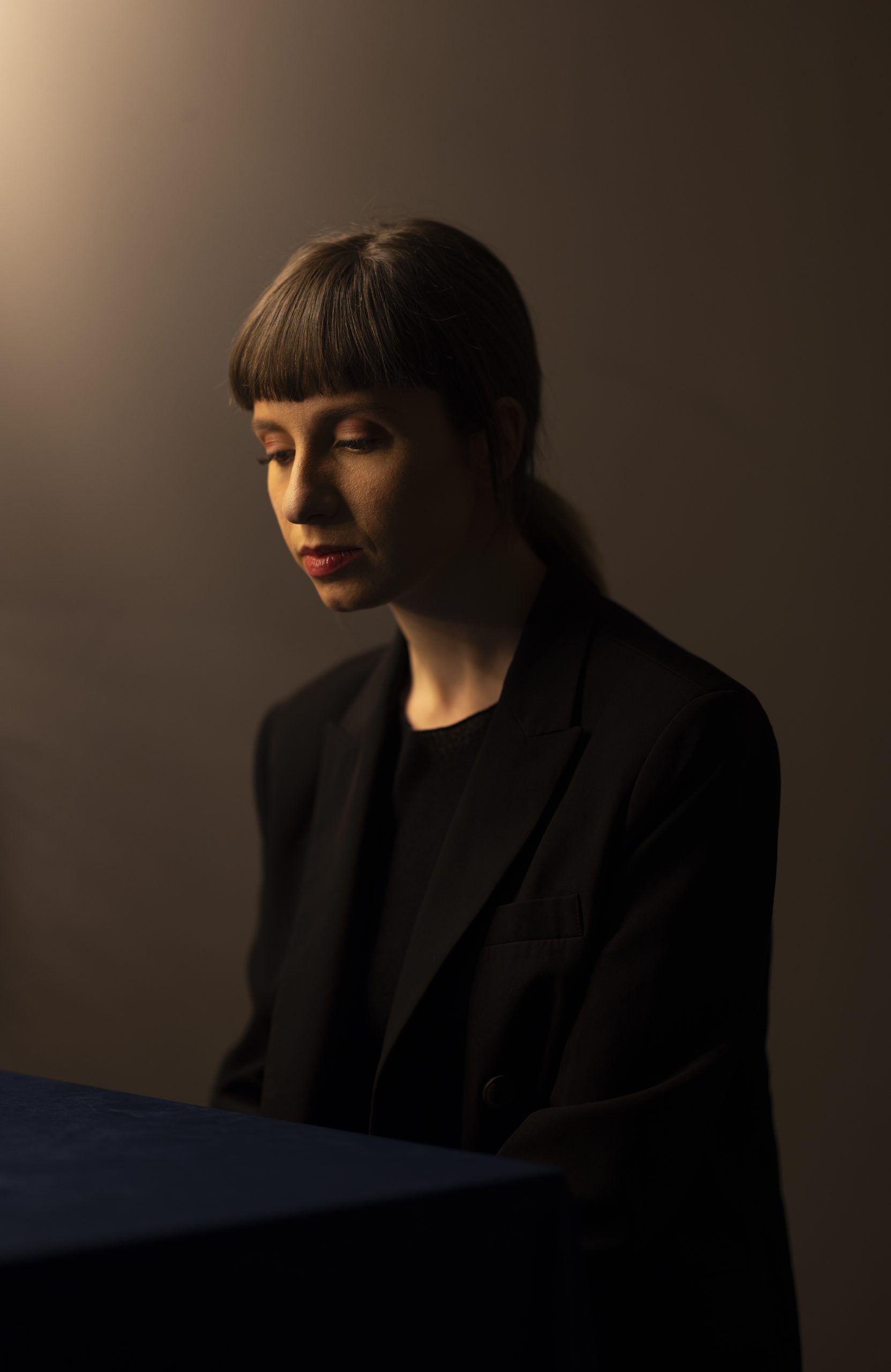 Portrait of a woman seated in soft side lighting