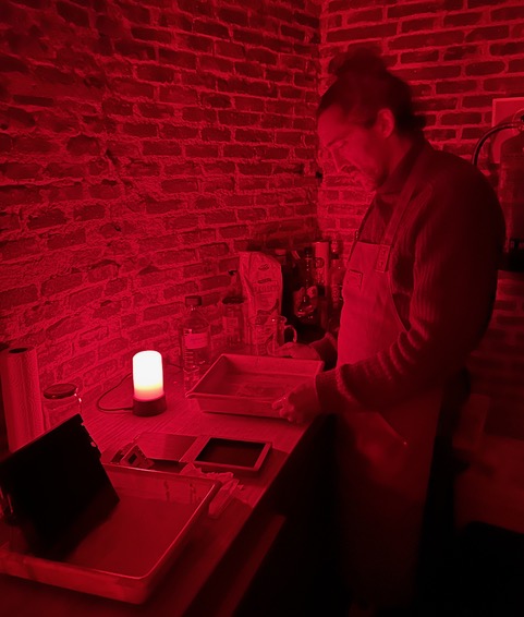 Achim Boers working in the darkroom during a wet plate collodion workshop